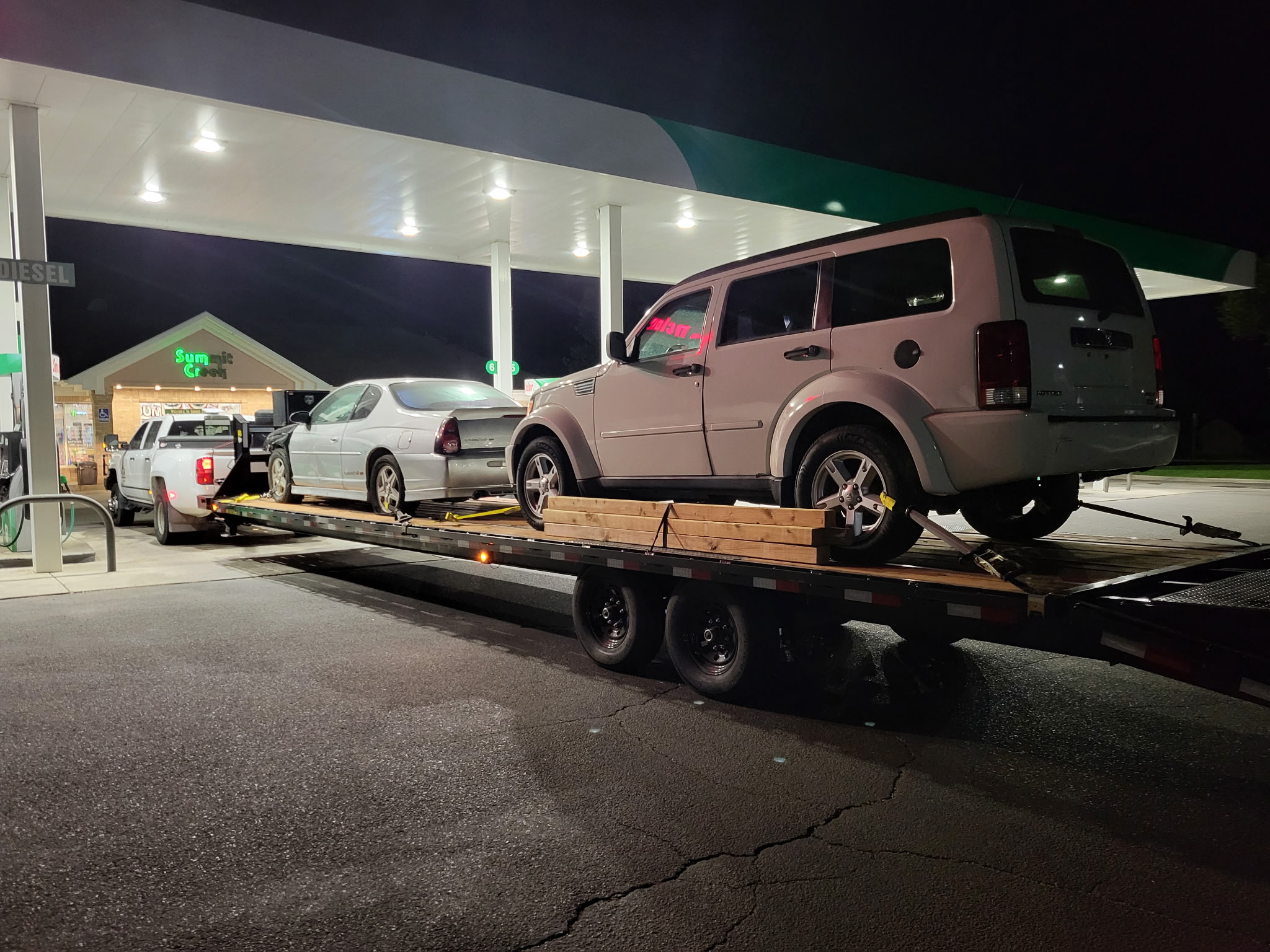 Two-vehicle load strapped down on the flatbed